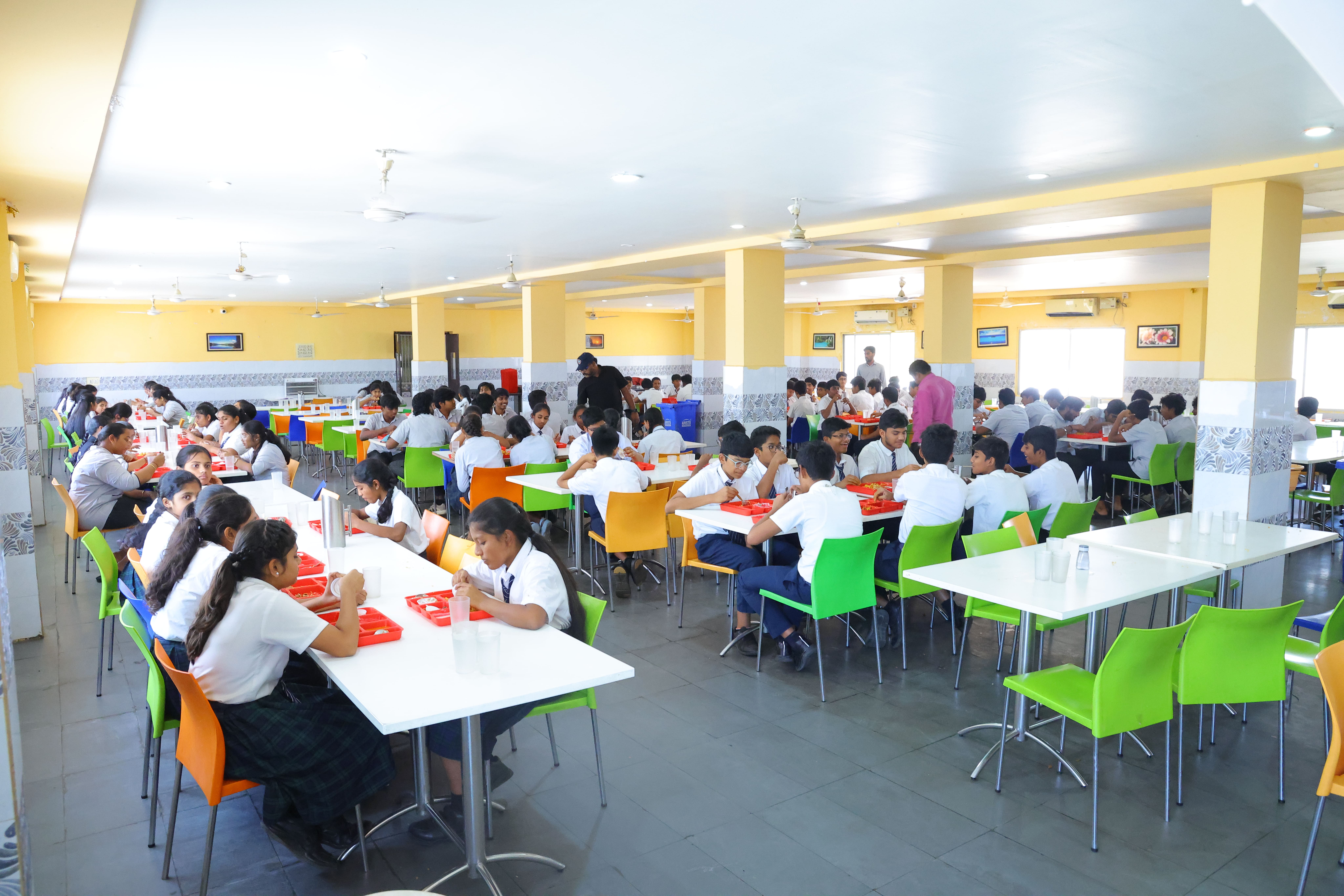 Students eating in the hostel dining area